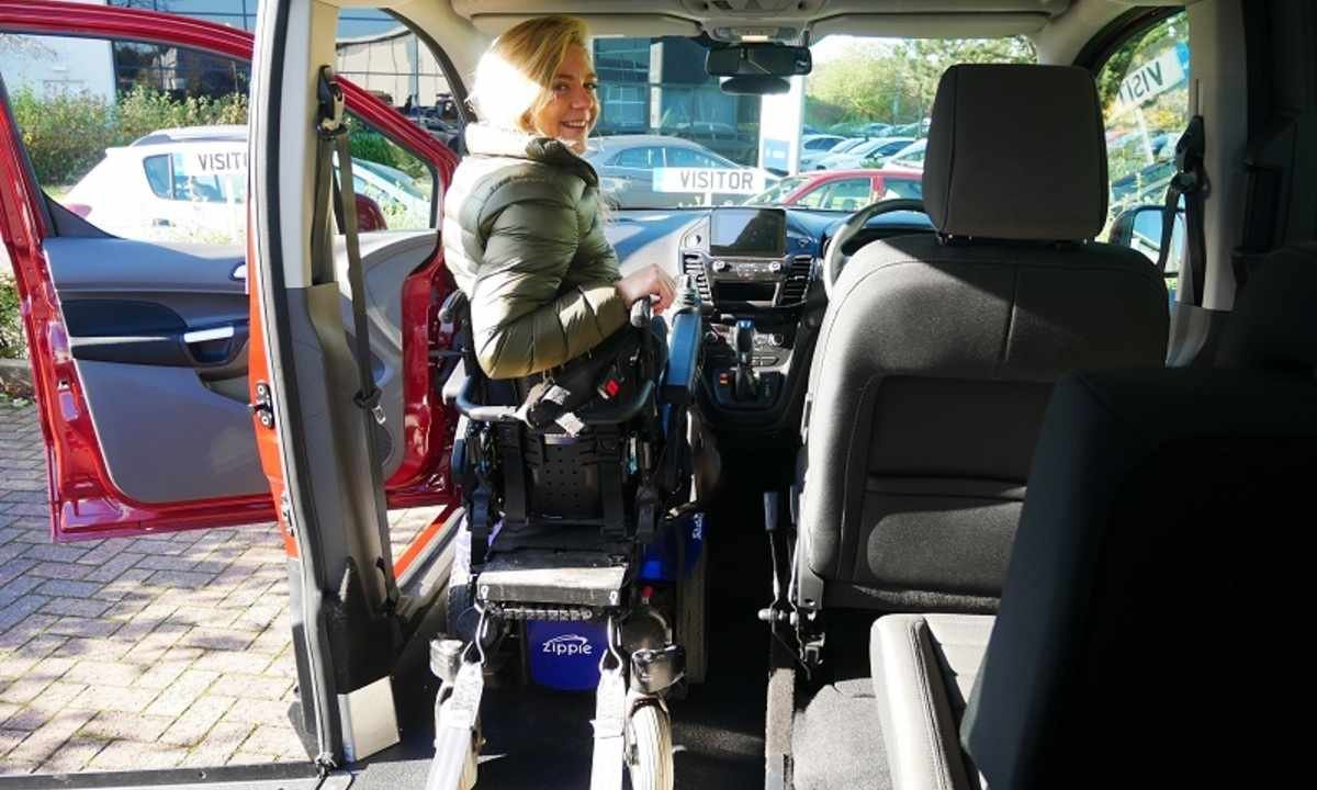 lady with wheelchair in the car