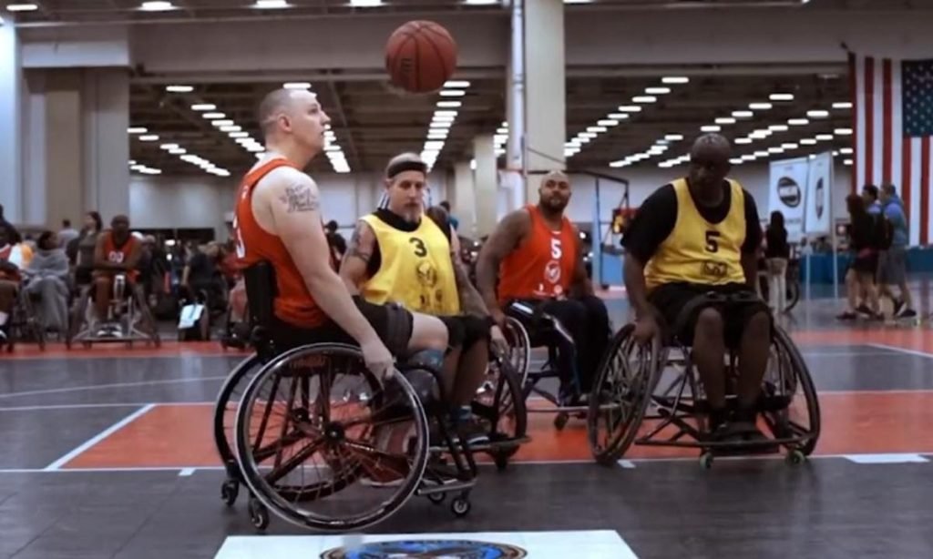 people on wheelchair playing sports